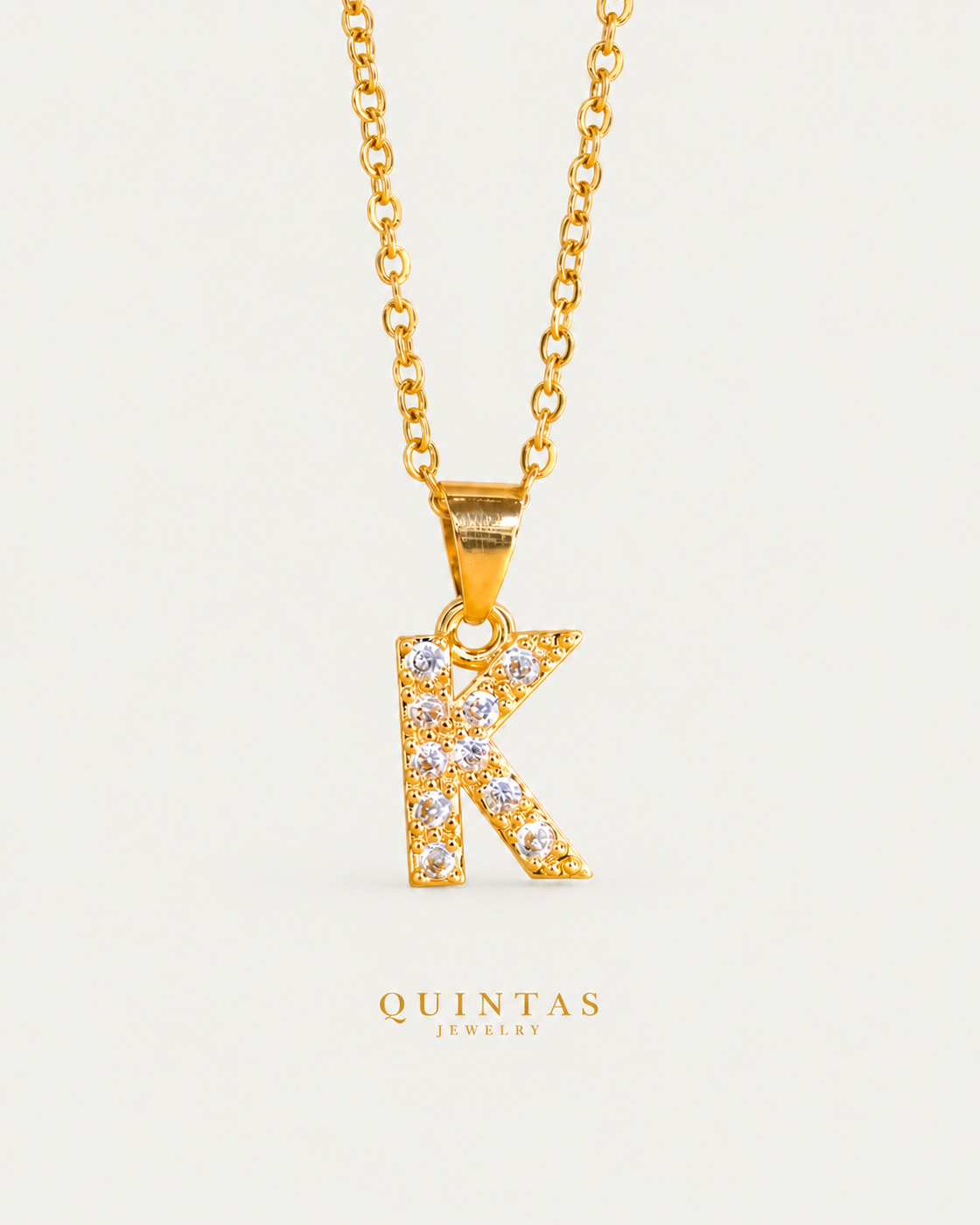 QUINTAS Zirconia Letter Initial Necklace — K / actual cable-chain front view, neutral greige