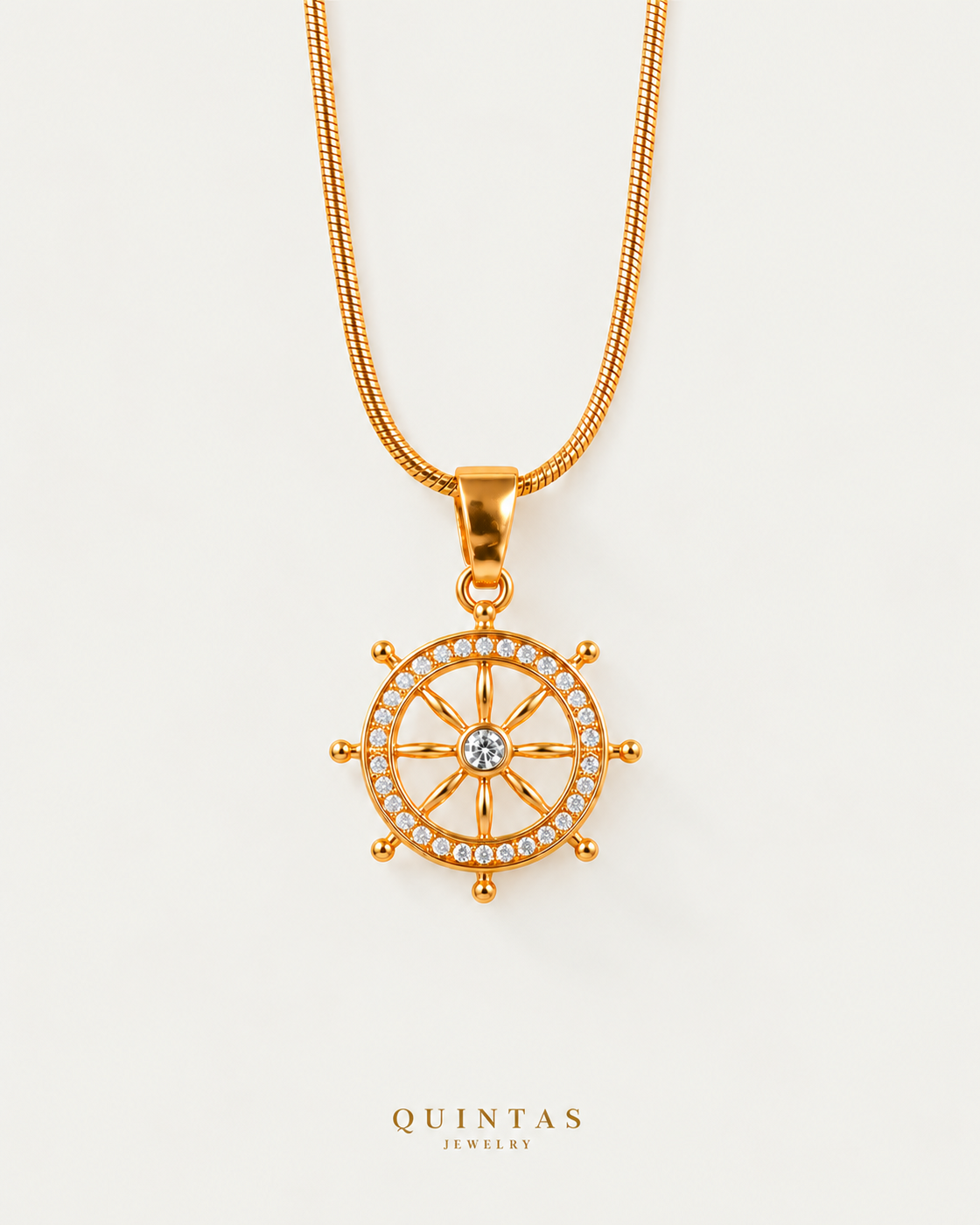 ships wheel necklace companion premium snake chain on neutral greige background