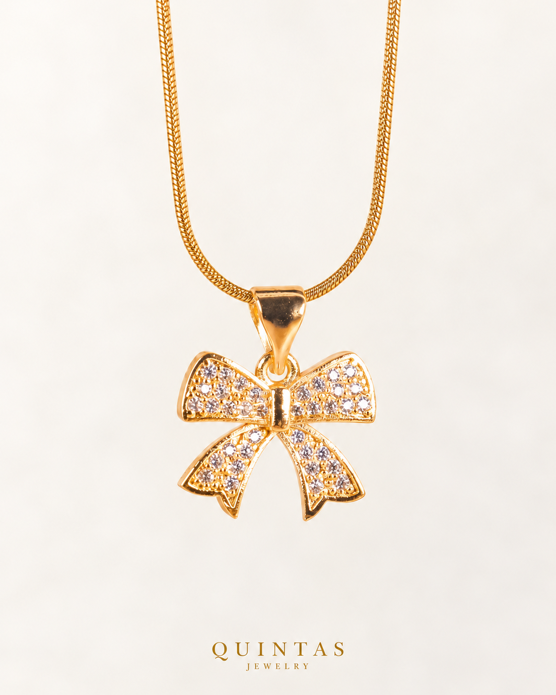 Velora Bow Necklace — actual Snake chain, source-faithful off-white second photo