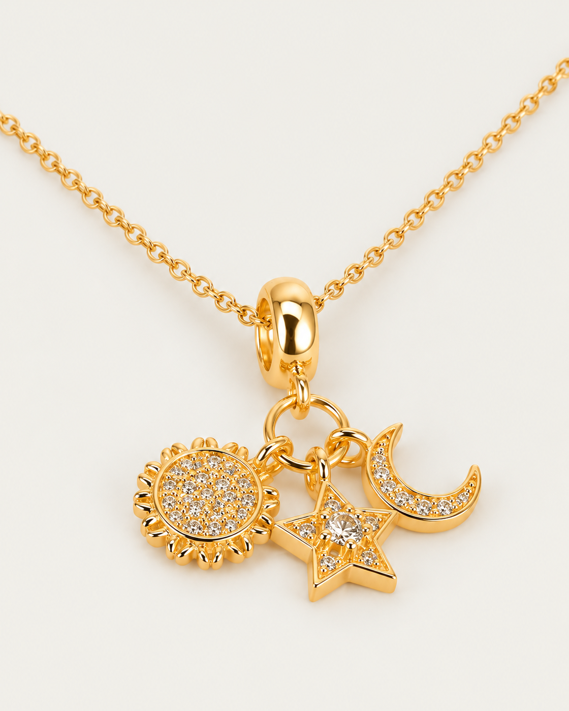 Sun, Moon, and Star Necklace, gold cable chain, oblique view