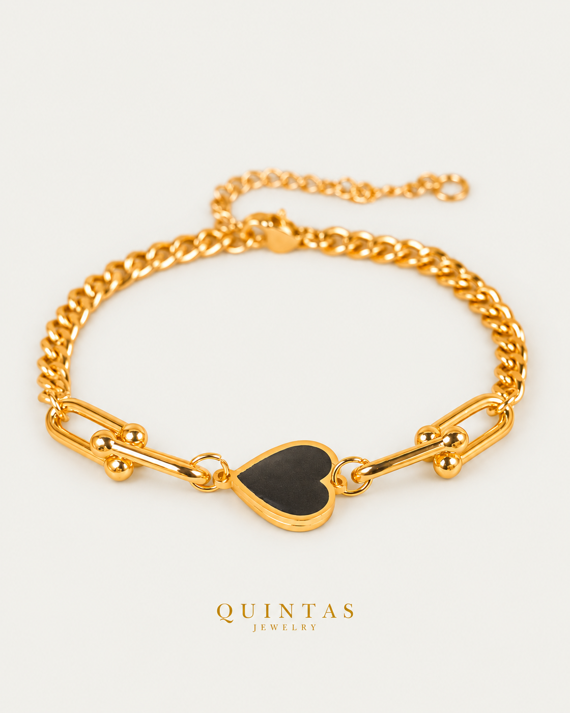 Vina Black Heart Bracelet — gold bracelet, front hero, neutral greige background