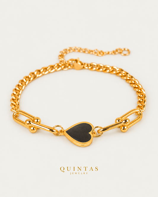 Vina Black Heart Bracelet — gold bracelet, front hero, neutral greige background
