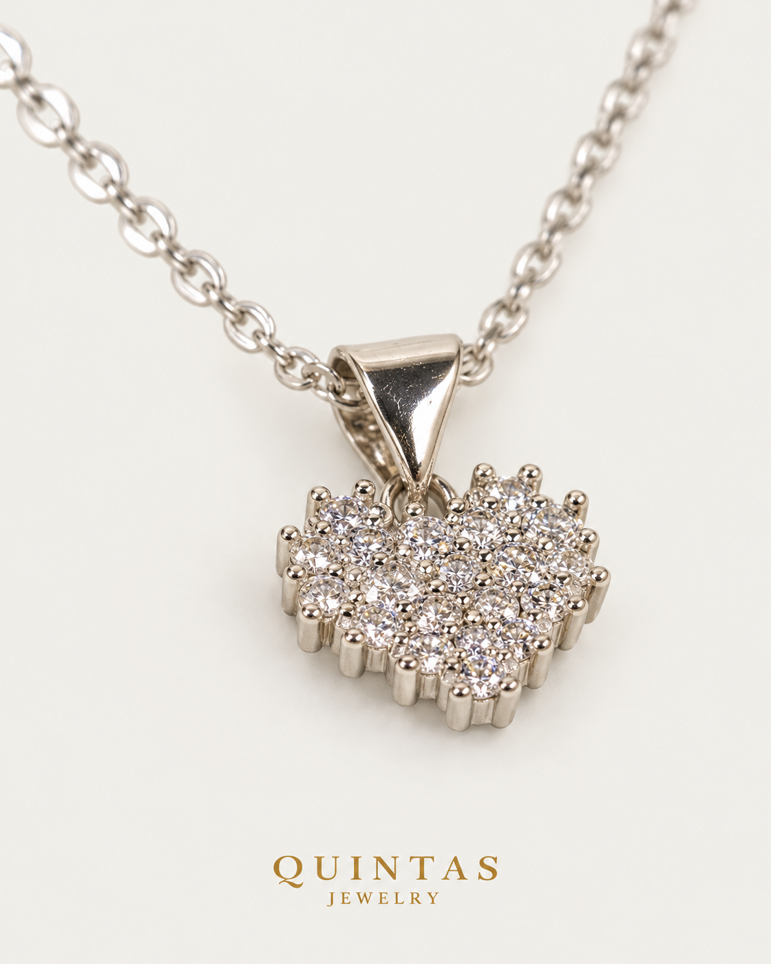 Zirconia Heart Silver — cable chain, genuine oblique detail, neutral greige background