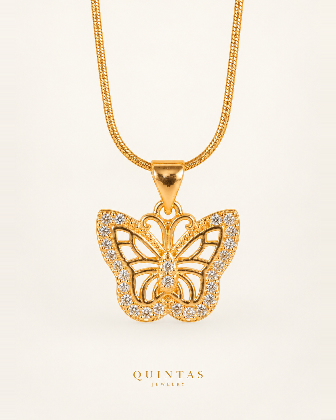 Charlotte Charming Butterfly Necklace — single physical gold Snake design on off-white background