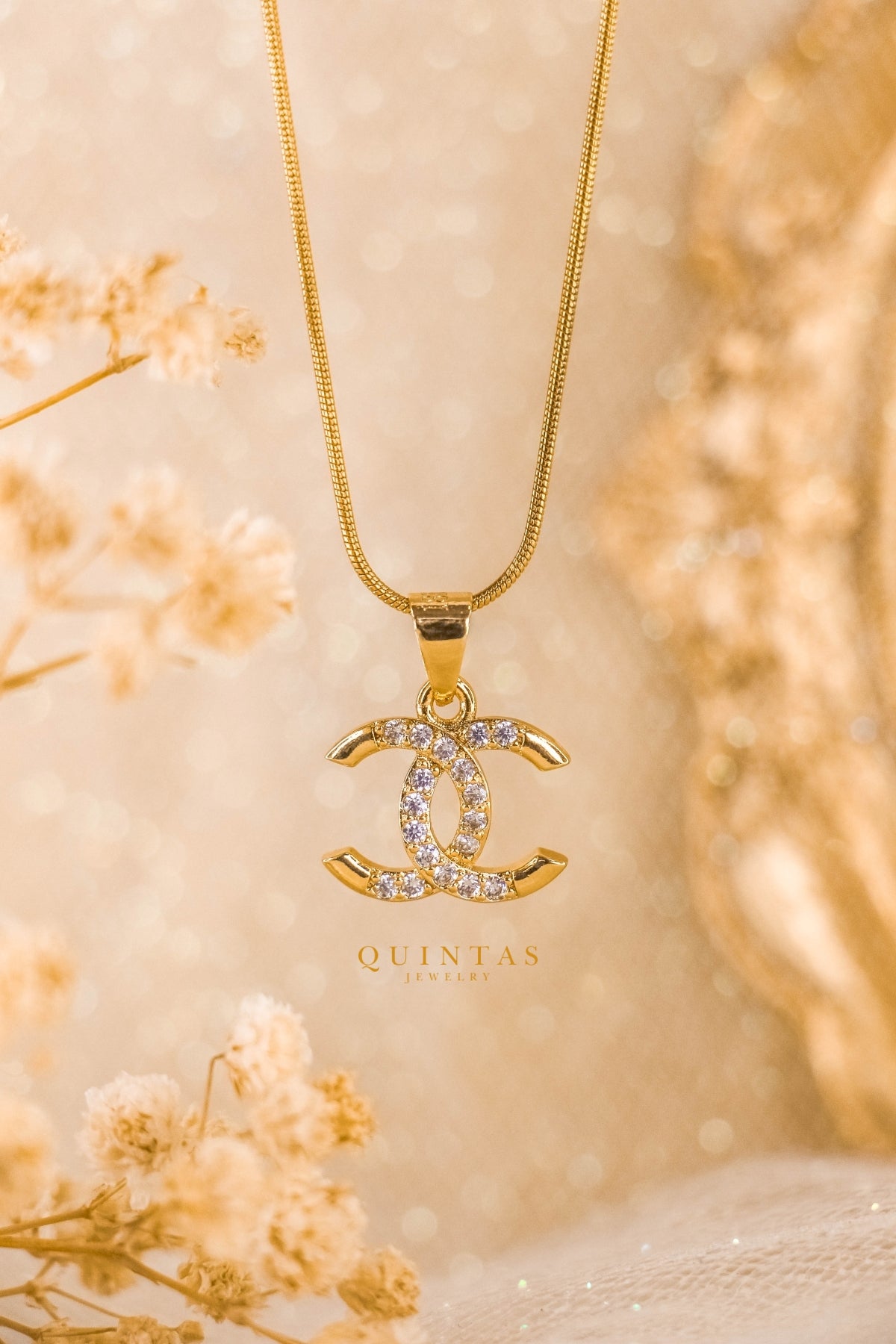 chanel logo diamond necklace